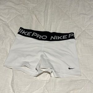Women’s white Nike pros